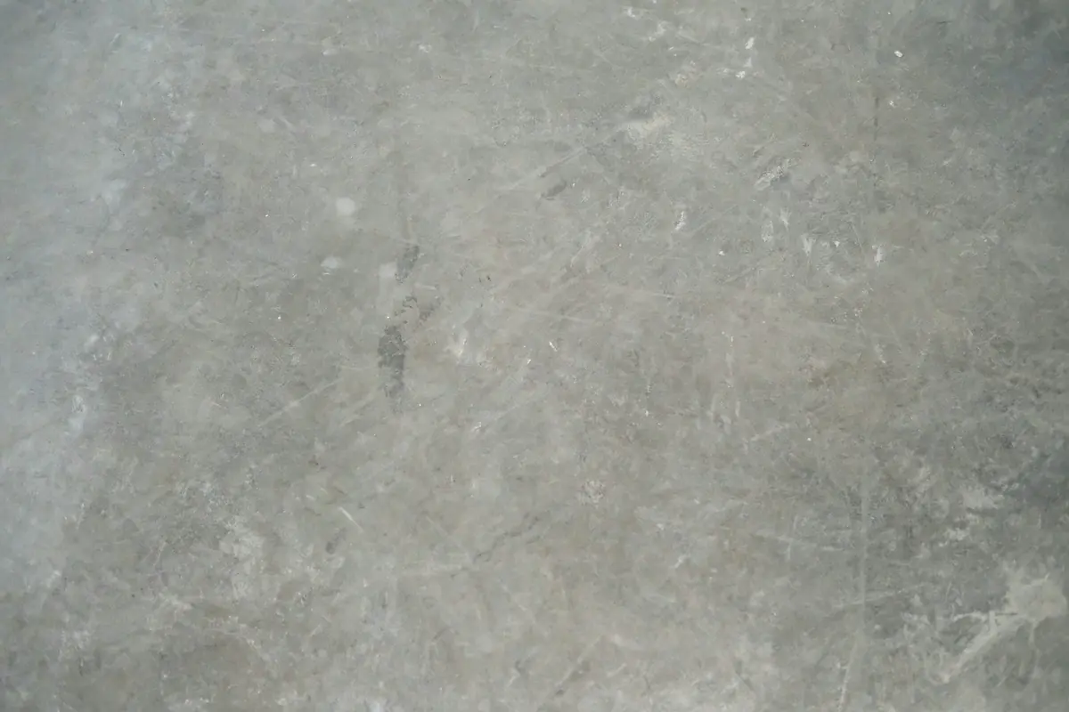 Close view of a honed grey stone floor