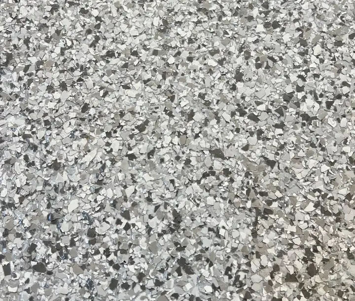 Aurora epoxy flake blend: mostly white and off-white flake with silver-grey chips
