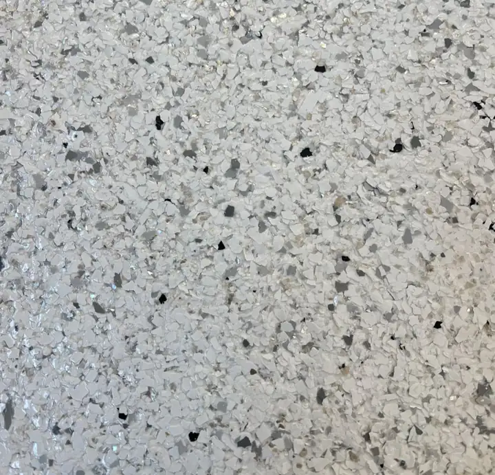 Bianco epoxy flake blend: bright white and off-white flake with sparse black flecks