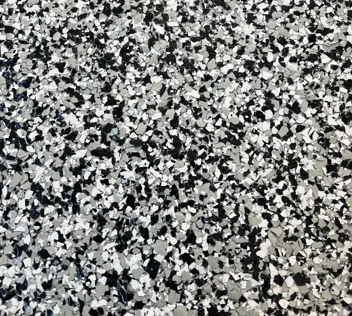 Domino epoxy flake blend: even mix of bright white, mid grey and black for a sharp salt-and-pepper finish