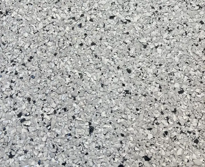 Galaxy epoxy flake blend: light grey field with sharp scattered black flecks