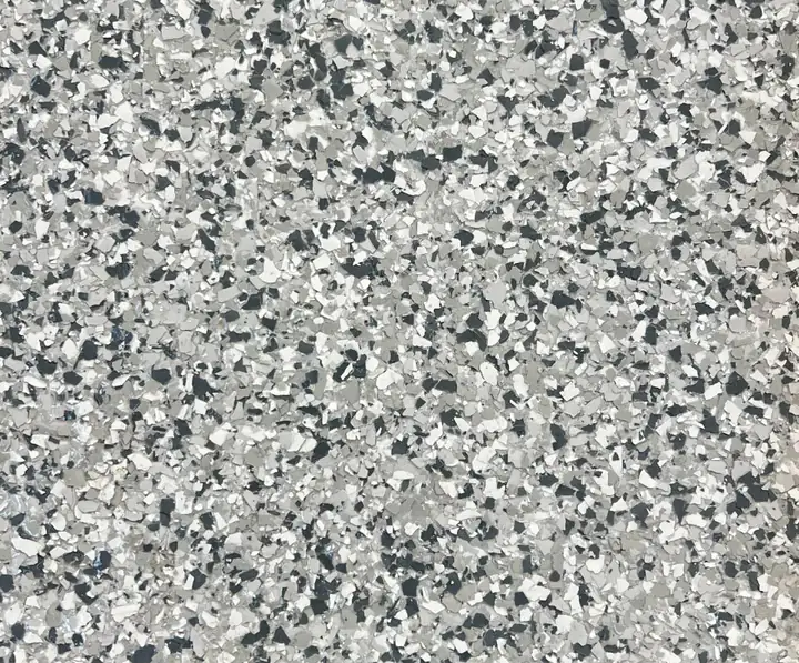 Gravel epoxy flake blend: white, light grey and charcoal flake over a pale grey base