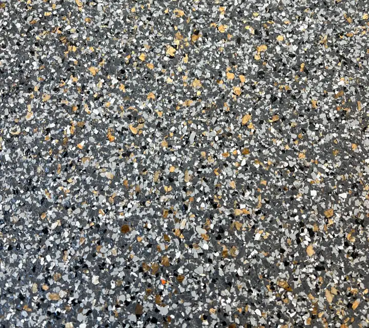 Solar Flare 1/8" epoxy flake blend: dark charcoal base lit with golden amber and tan flake
